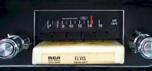 Picture of Elvis eight track tape inserted into automobile tape player
